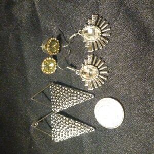 Three pairs of earrings.